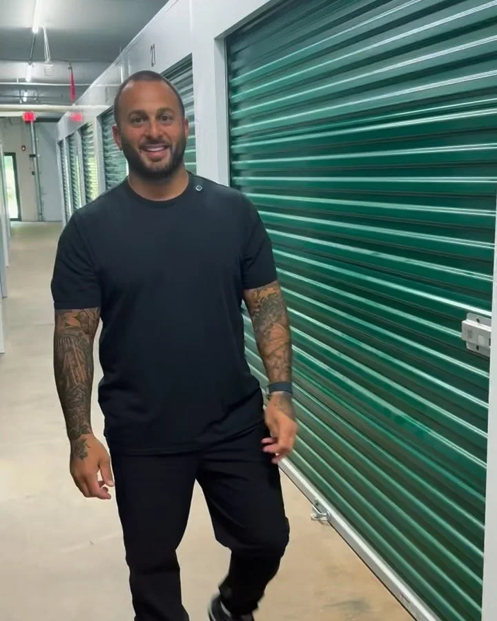 Golden Rule Movement founder standing in the newly rented storage unit